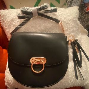 New with plastic coverings. Aldo black crossbody bag with nice gold hardware